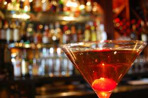 manhattan in glass with cherries