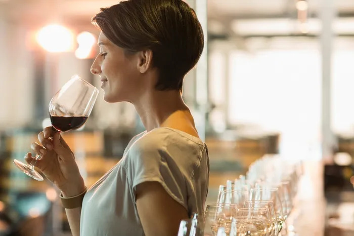 a woman holding a wine glass